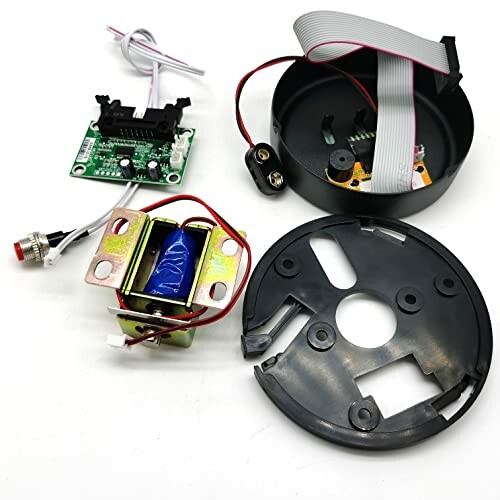 Assorted electronic components including a circuit board, wires, and plastic casing.