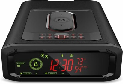Gun safe with digital clock and lock controls.
