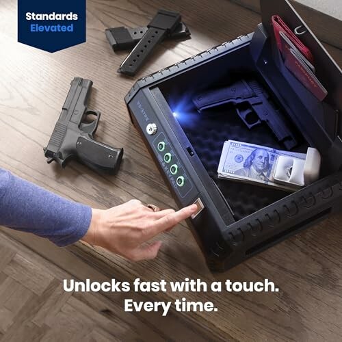 Person using touch unlock gun safe with money and handgun inside.