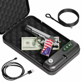 Opened gun safe with a handgun, USB cable, money, and a security cable.