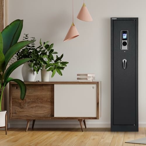 Modern living room with a tall black safe and wooden cabinet.