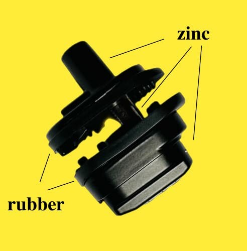 Black rubber and zinc component on yellow background.